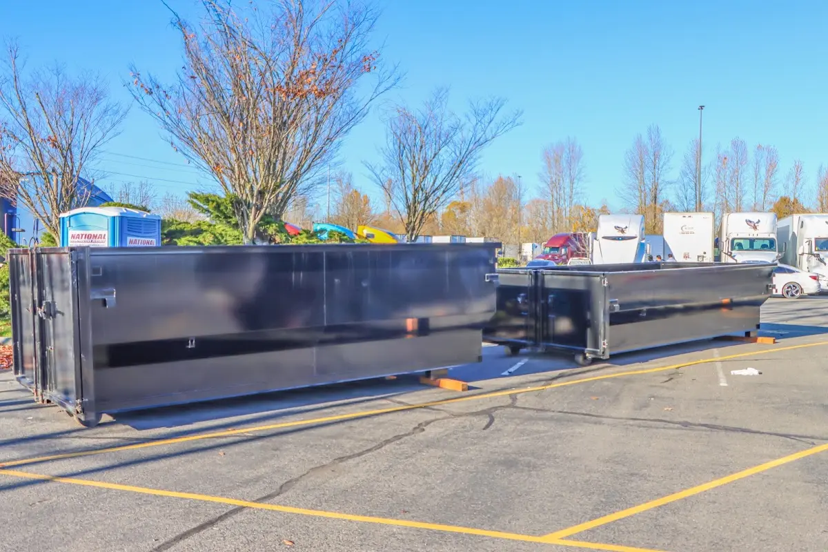 Professional dumpster rental service with roll-off container on residential driveway in Wichita Falls